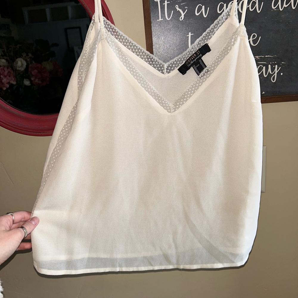 White, lightweight tank top with lacy detailing at the top
